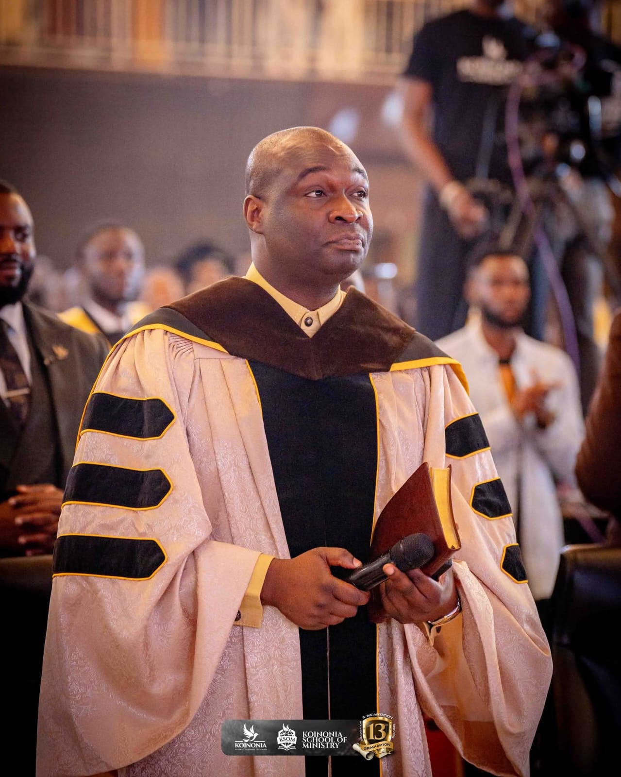 Apostle Joshua Selman walks up to the stage