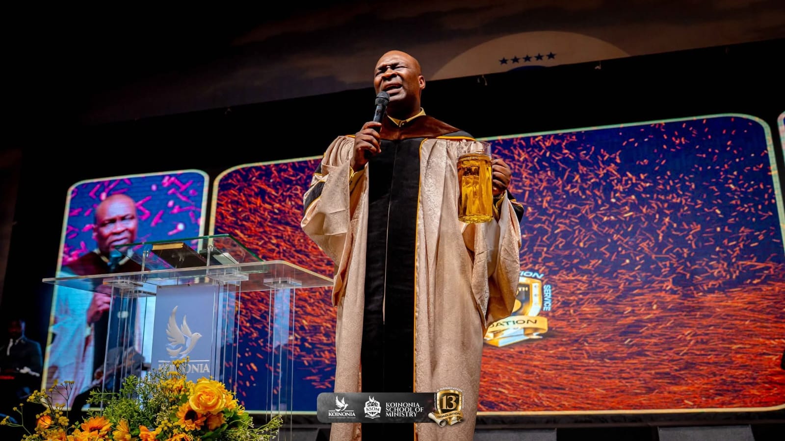 AJS Standing prays over the anointing oil