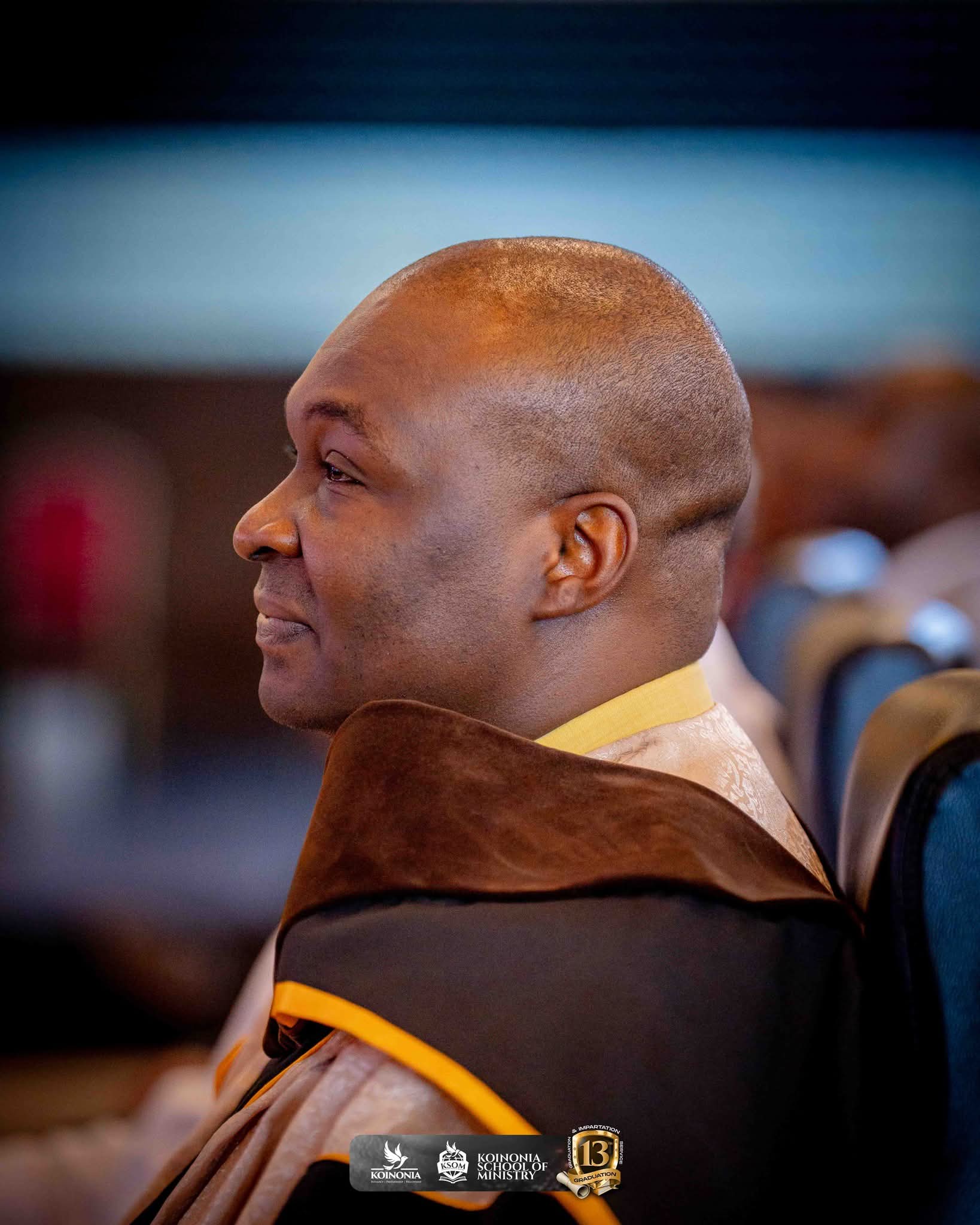 Apostle Joshua smiles as he watches the stage