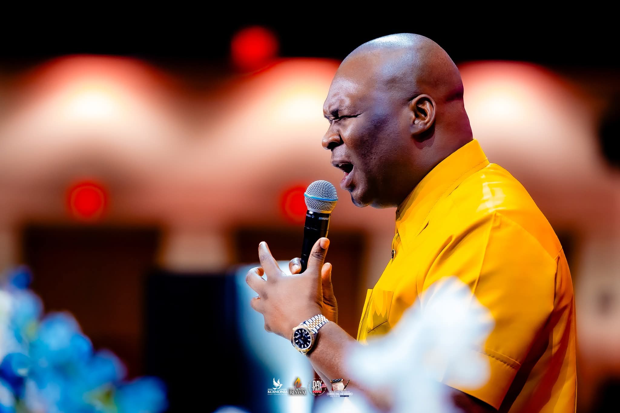 Apostle Joshua on stage worshipping